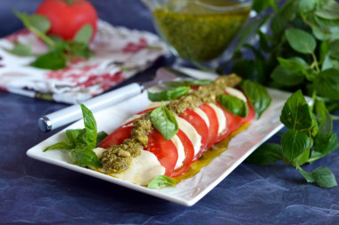 Caprese tomatoes with pesto and mozzarella