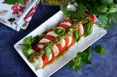 Caprese tomatoes with pesto and mozzarella