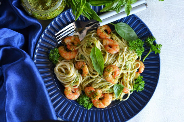 Pasta with pesto sauce and shrimp