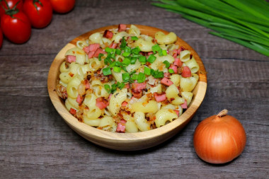 Pasta with sausage in a frying pan