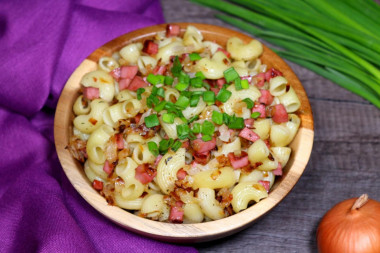 Pasta with sausage in a frying pan