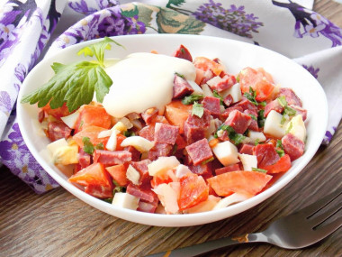 Salad with smoked sausage and tomatoes