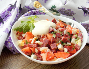 Salad with smoked sausage and tomatoes