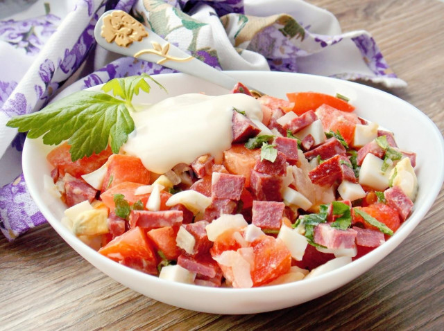 Salad with smoked sausage and tomatoes