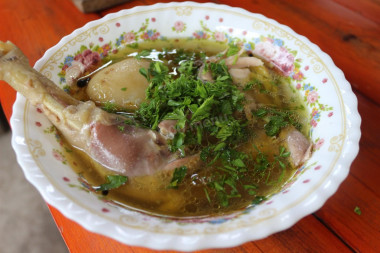 Homemade rustic rooster soup