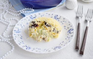 Salad with chicken, prunes, cucumber and cheese