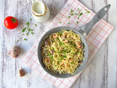 Pasta with a sea cocktail in cream sauce