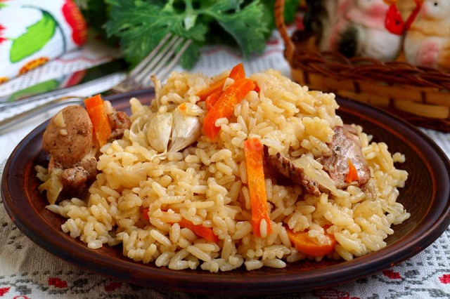 Rabbit pilaf in a cauldron