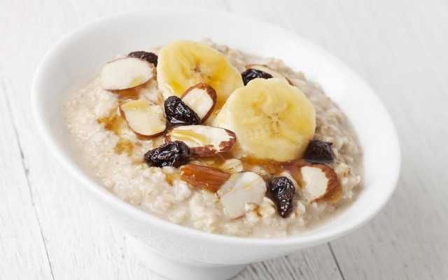 Oatmeal porridge with honey on water