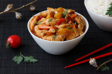 Chicken with peaches in sweet and sour sauce