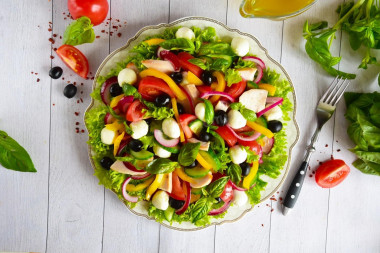 Salad with smoked breast, tomatoes, cheese and cucumbers