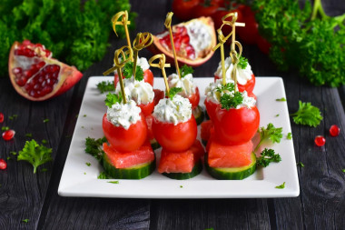 Canapé with red fish on skewers with cottage cheese