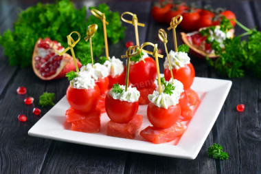 Canapé with red fish on skewers with cottage cheese