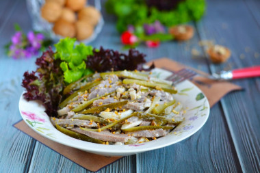 Salad with tongue and pickled cucumbers