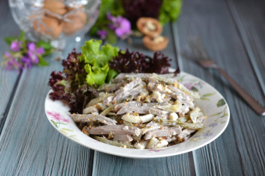 Salad with tongue and pickled cucumbers