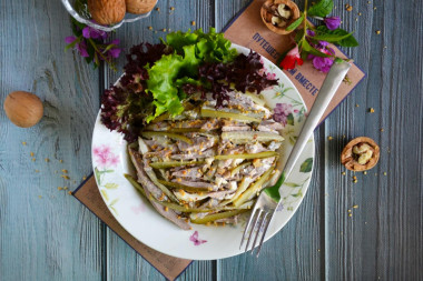 Salad with tongue and pickled cucumbers