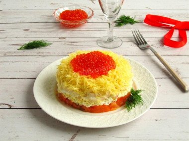 Well-fed boatswain salad with salmon and red caviar