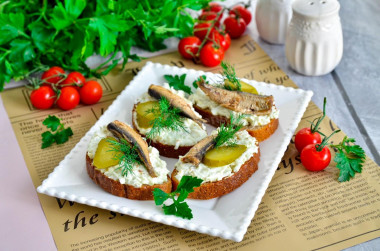 Sandwiches with sprats, eggs and pickled cucumber