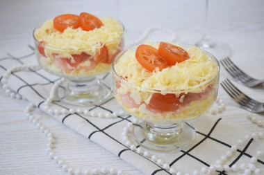 Salad with cheese, egg and shrimp in creamers