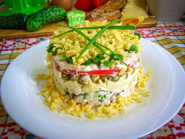 Salad with soft cheese cucumber tomato chicken peas egg