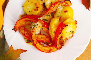 Pumpkin with honey and potatoes baked in the oven