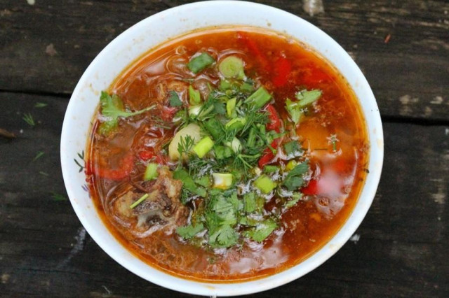 Lamb shulyum on a fire in a cauldron