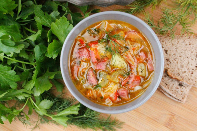 Young cabbage soup with smoked sausage