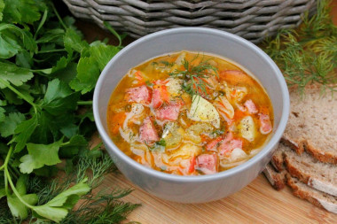 Young cabbage soup with smoked sausage