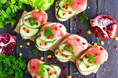 Sandwiches with red fish and cucumber