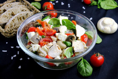 Salad with chicken mushrooms tomatoes and cheese