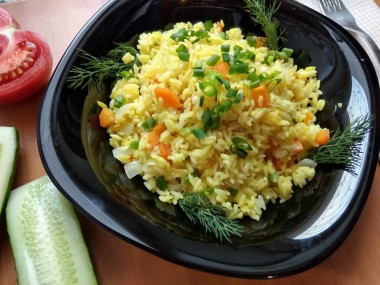 Rice with carrots and onions in a slow cooker