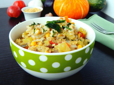 Bulgur with vegetables on the stove