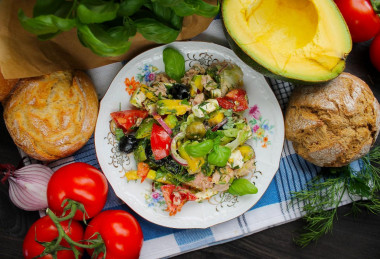 Mediterranean salad with tuna, cheese, avocado and olives