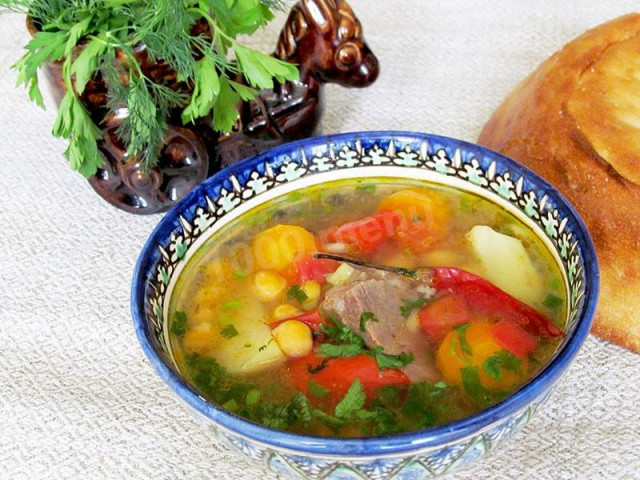 Shurpa with chickpeas and lamb in a saucepan