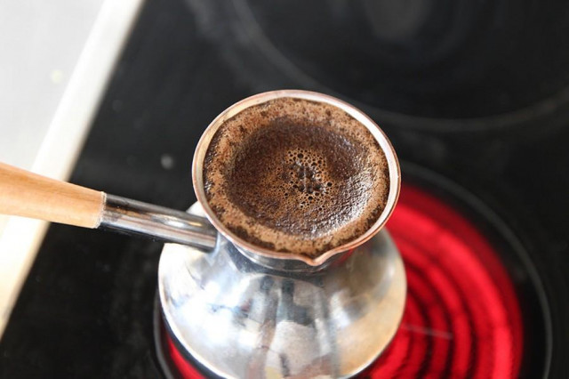 Coffee in a turk on an electric stove