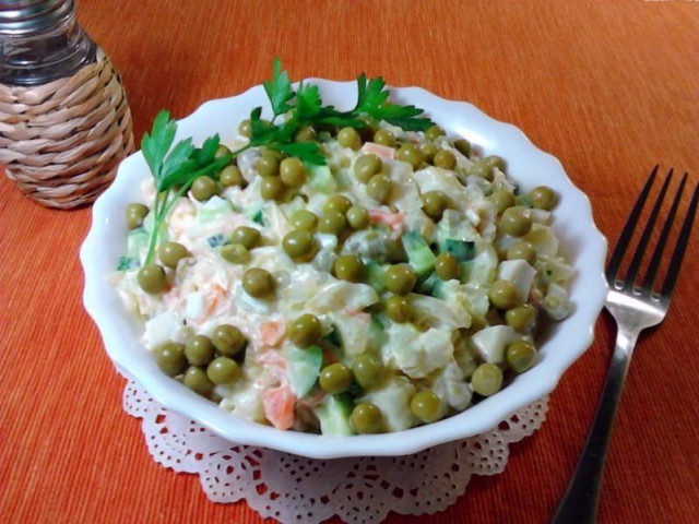 Sauerkraut salad with potatoes and cucumbers