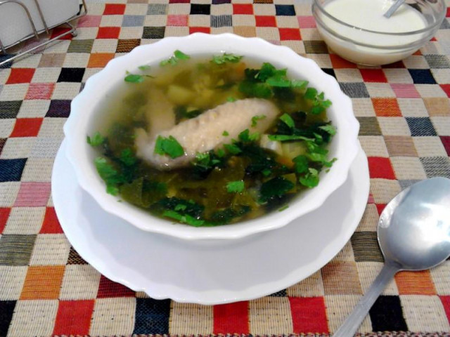 Green cabbage soup with nettles, chicken and sorrel and egg