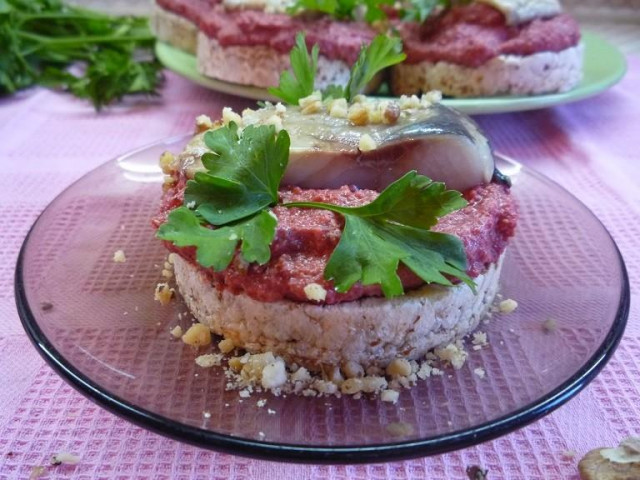 Canapes with herring and beetroot pesto