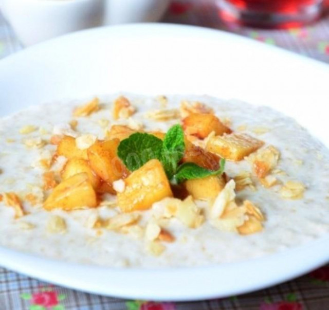 Oatmeal porridge with caramel apples and almonds