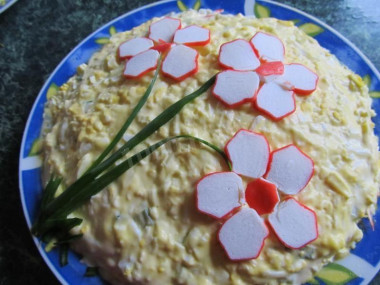 Salad with melted cheese, cucumber and crab sticks