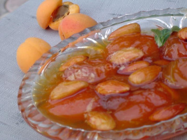 Pitted apricot jam with almonds in water