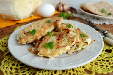 White cabbage in batter in a frying pan