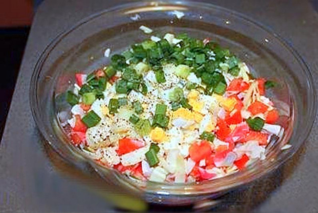 Salad with crab meat and cabbage and tomatoes