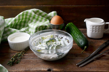 Salad from fresh cucumbers in sour cream