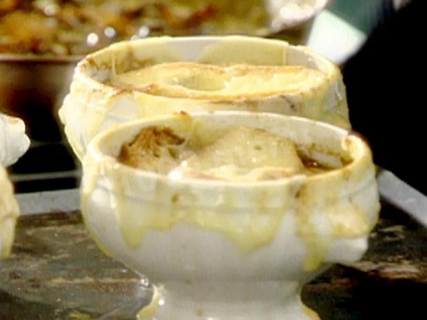 Onion soup with cheese croutons, garlic and hard cheese