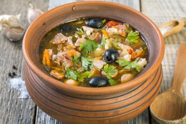 Solyanka in pots in the oven, combined meat