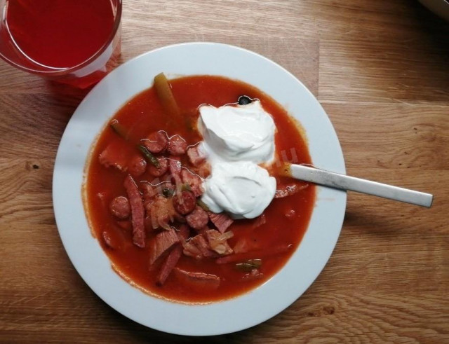 Beef solyanka with sausages onion tomato paste