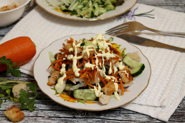 Salad with Korean carrots, smoked sausage and cucumbers