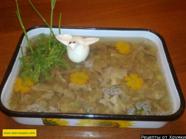 Beef aspic with onions, carrots and parsley