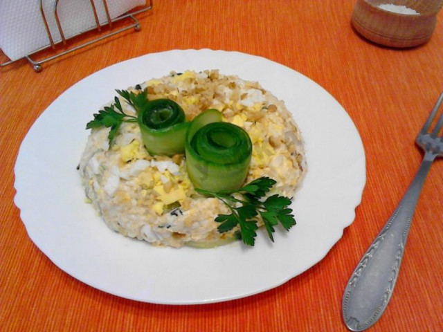 Salad with cheese, nuts, quail egg